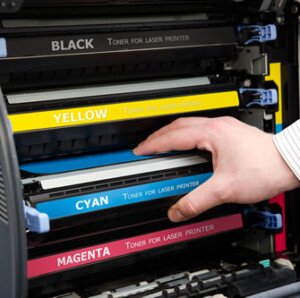 hand with printer cartridge
